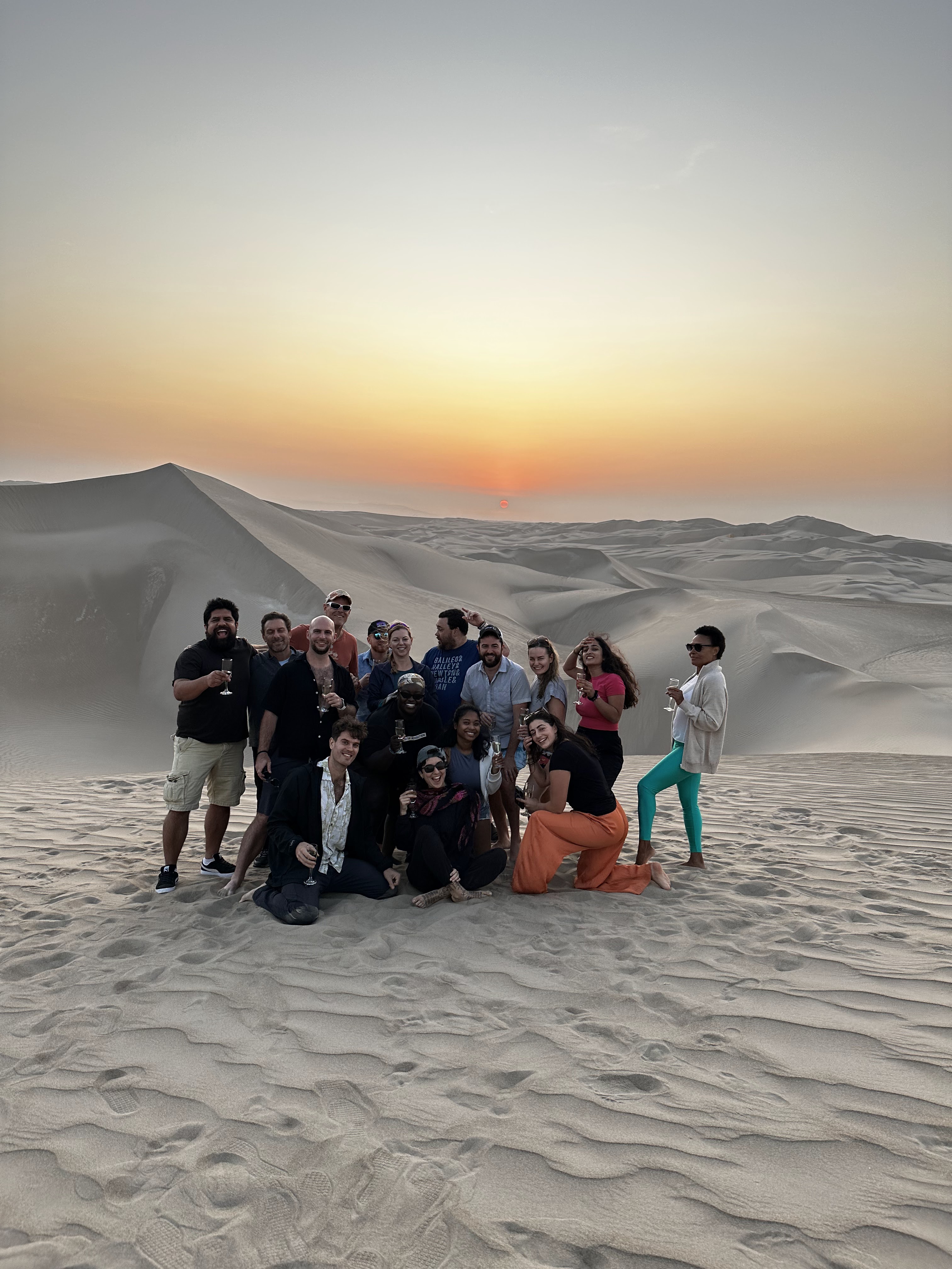 Group of travellers celebrating at a destination